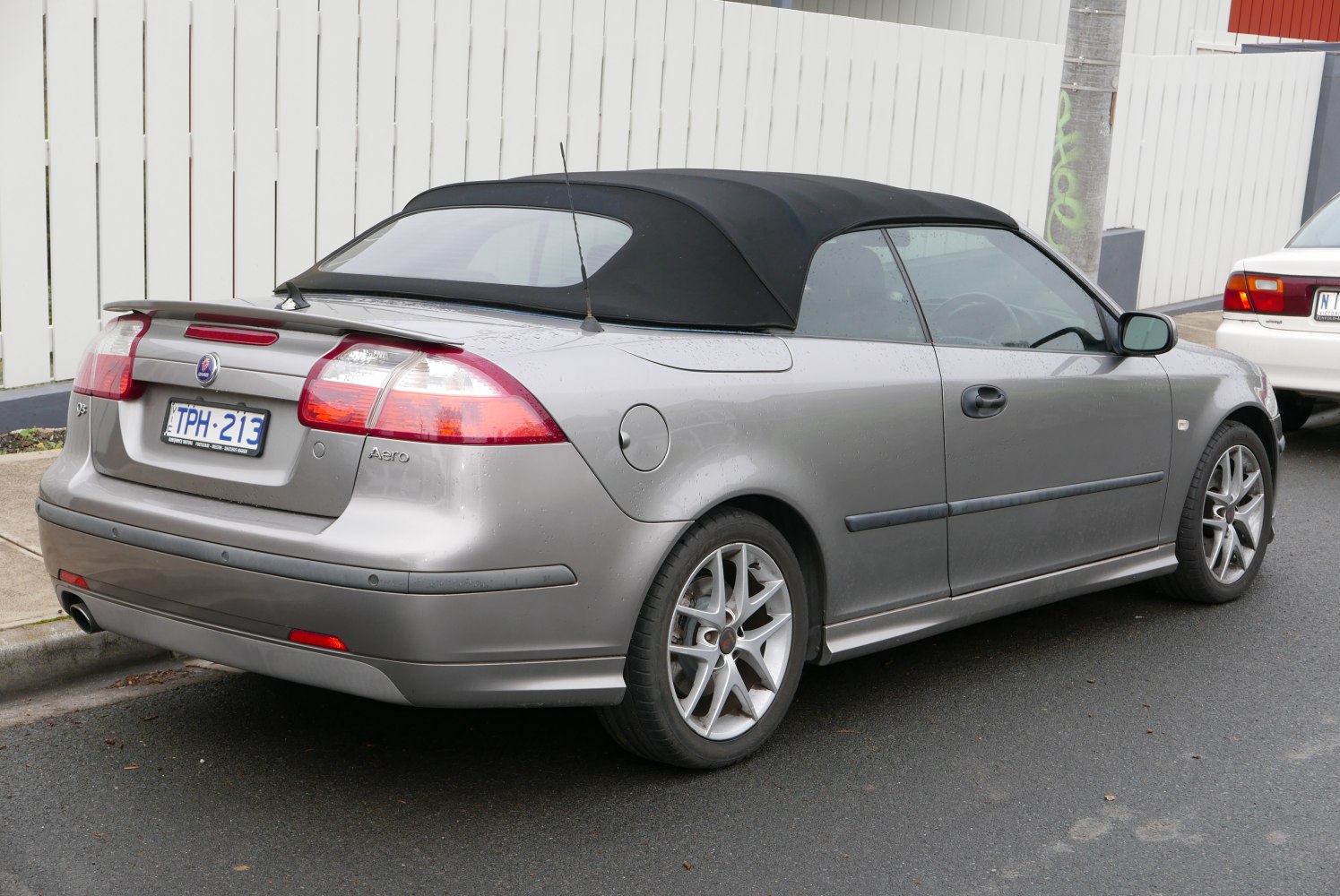 Soft top convertible with rear spoiler and alloy wheels