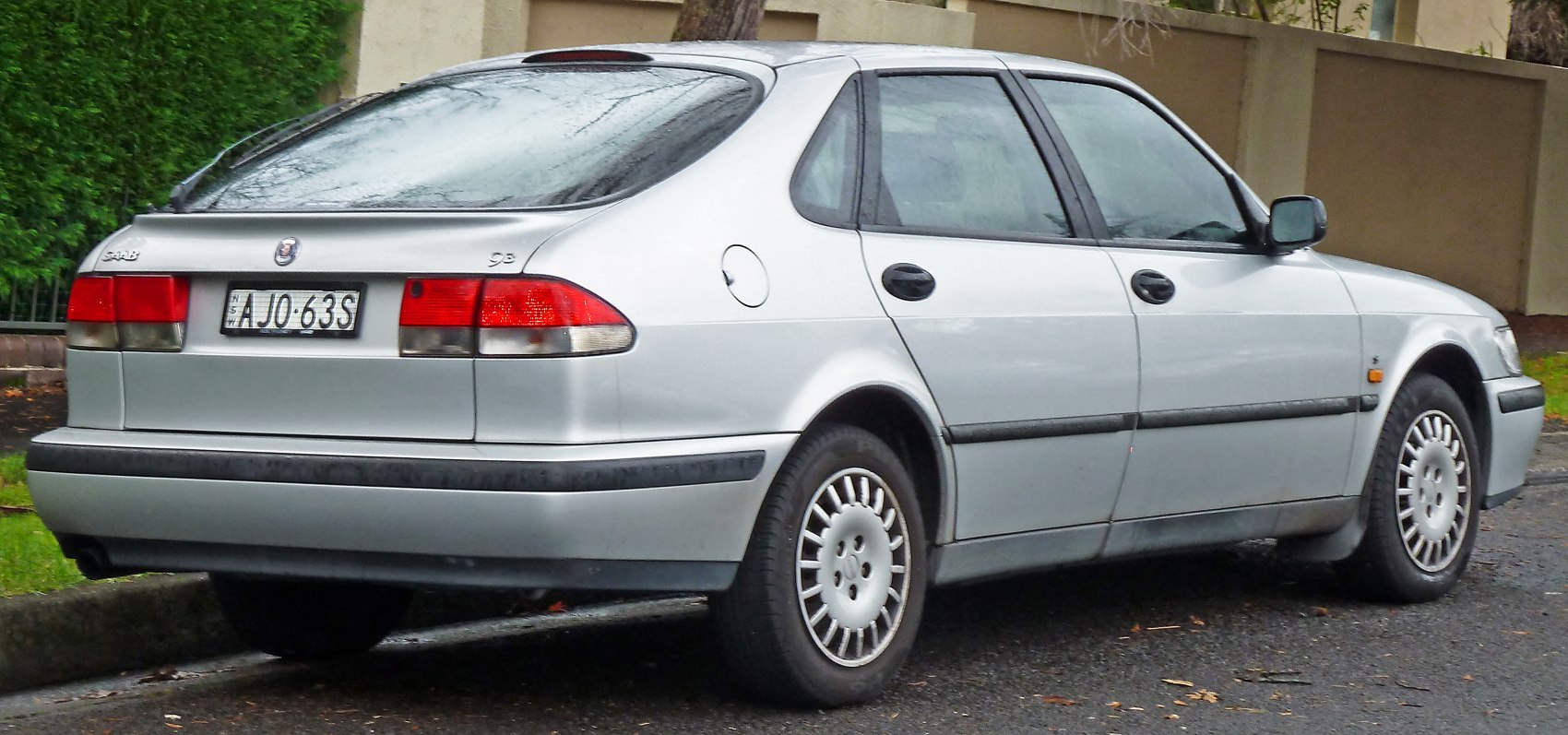 Silver sedan with hatchback rear design and alloy wheels