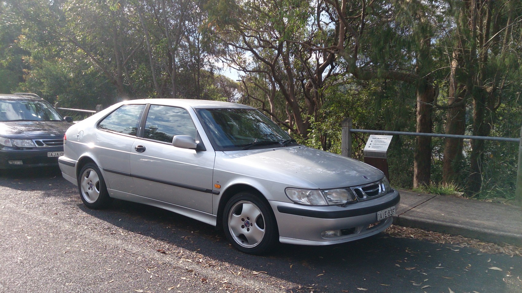 Silver 3-door hatchback with alloy wheels and side view