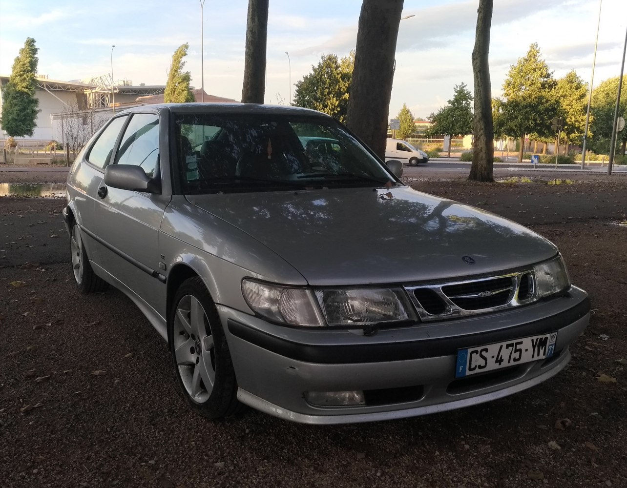 Front view with distinctive headlights, grille, and alloy wheels