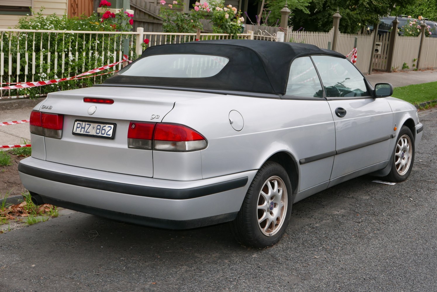 Rear view of convertible with soft top and alloy wheels