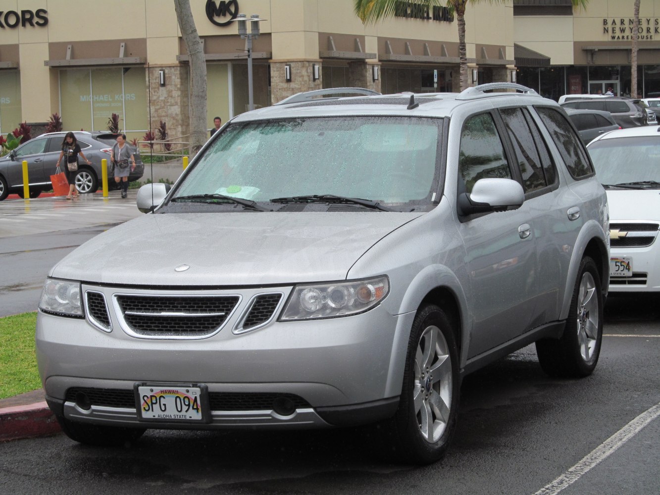 Silver SUV front view with distinctive grille and headlights