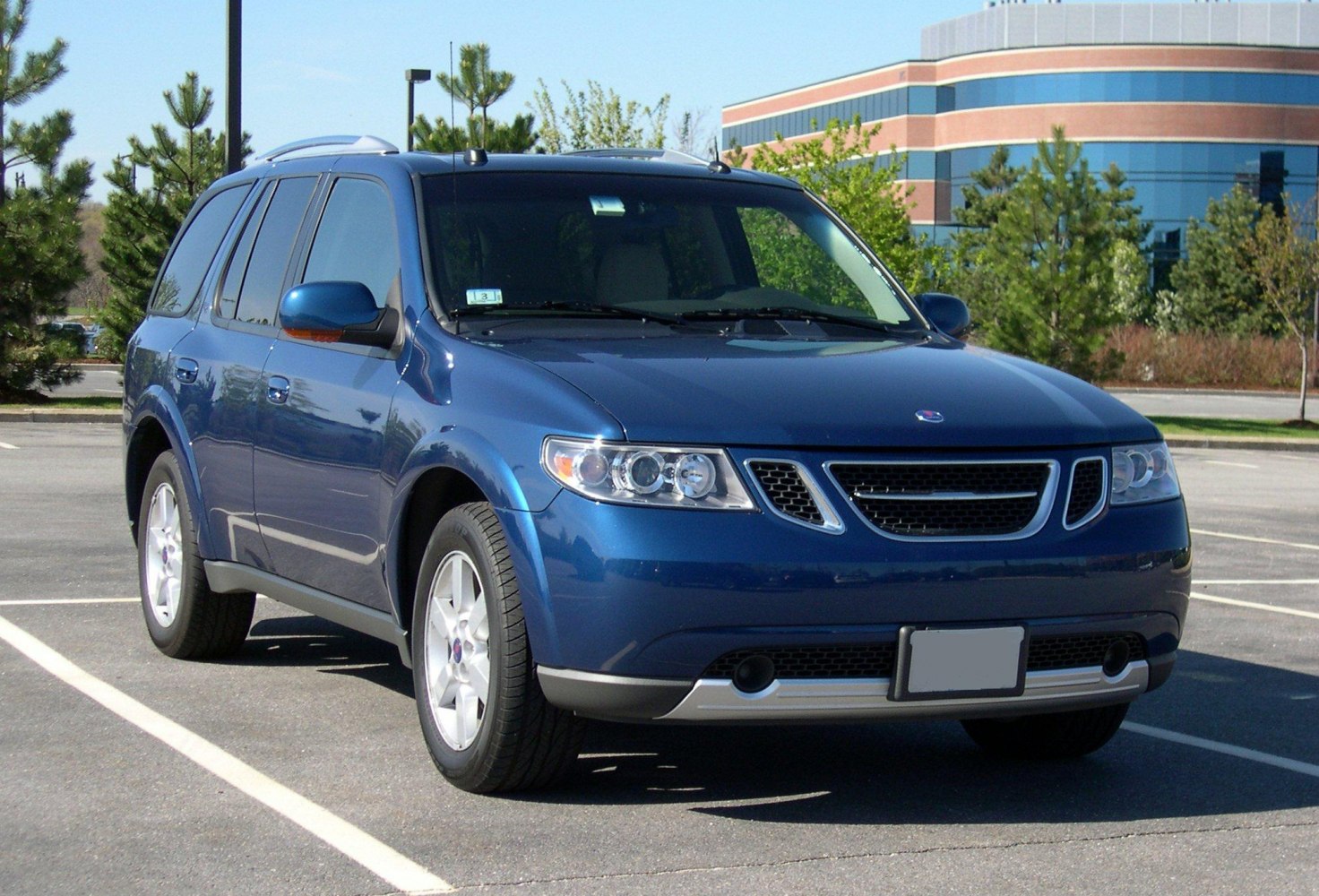 Blue SUV front side view with distinctive grille and headlights