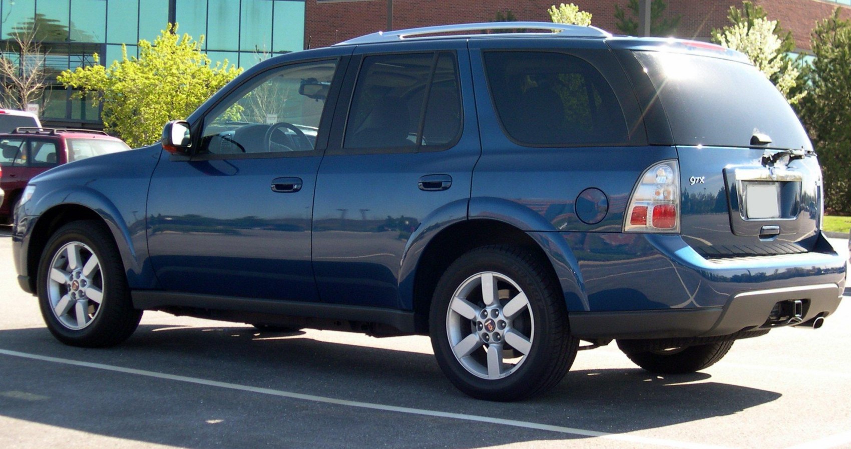 Side view of an SUV with tinted rear windows and alloy wheels