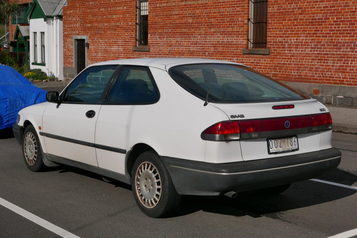 Rear side view of classic hatchback with distinctive lights and shape