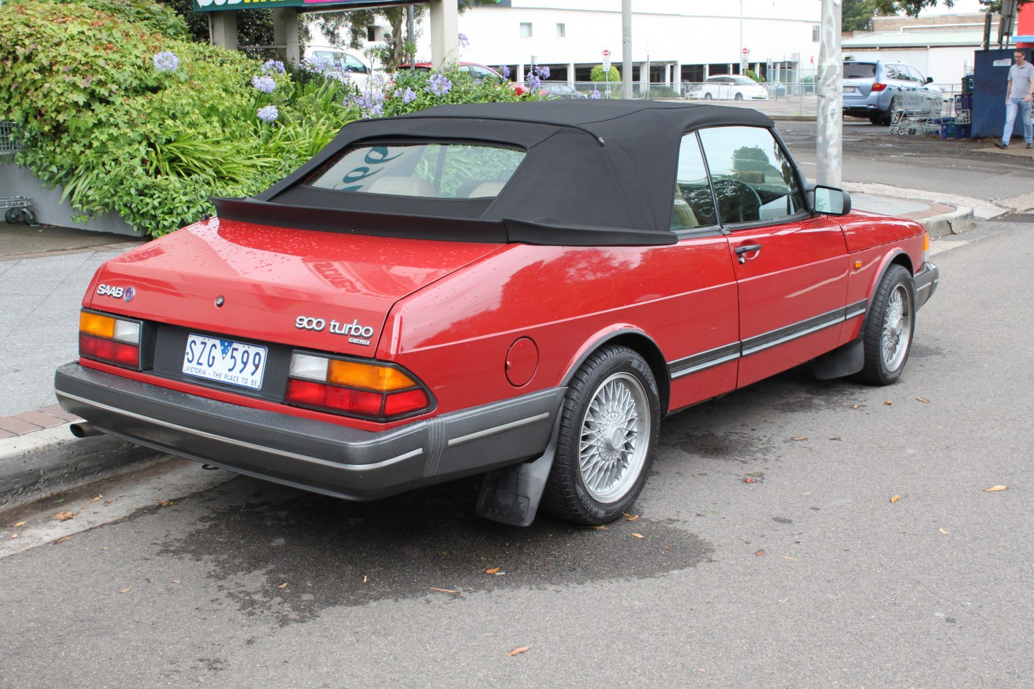 Red convertible rear with soft top and turbo badge