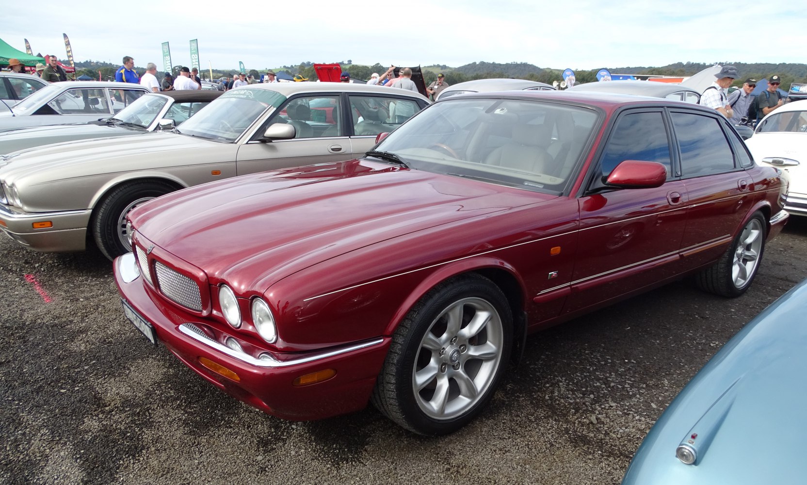 Classic sedan with prominent front grille and alloy wheels