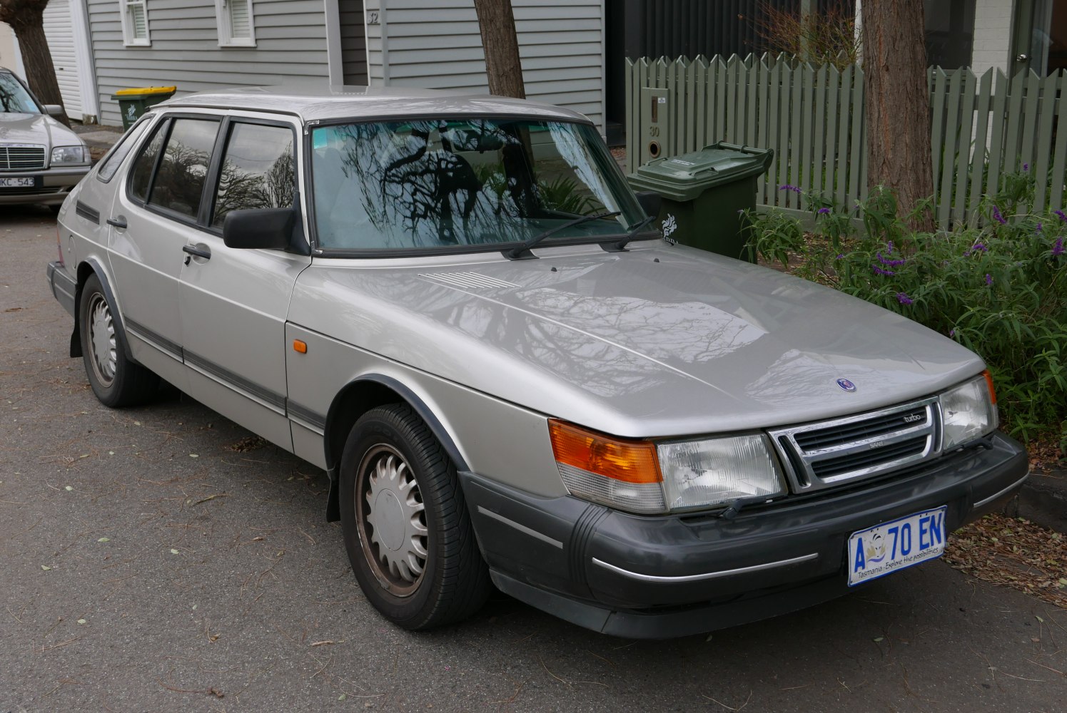 Vintage silver sedan with turbo grille and rectangular headlights.