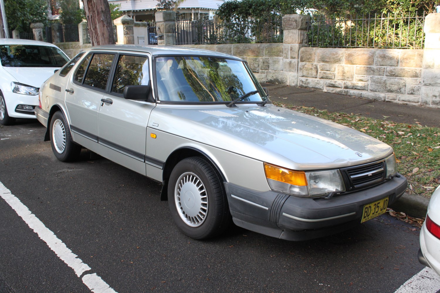 Front side view showing angular design and classic sedan features