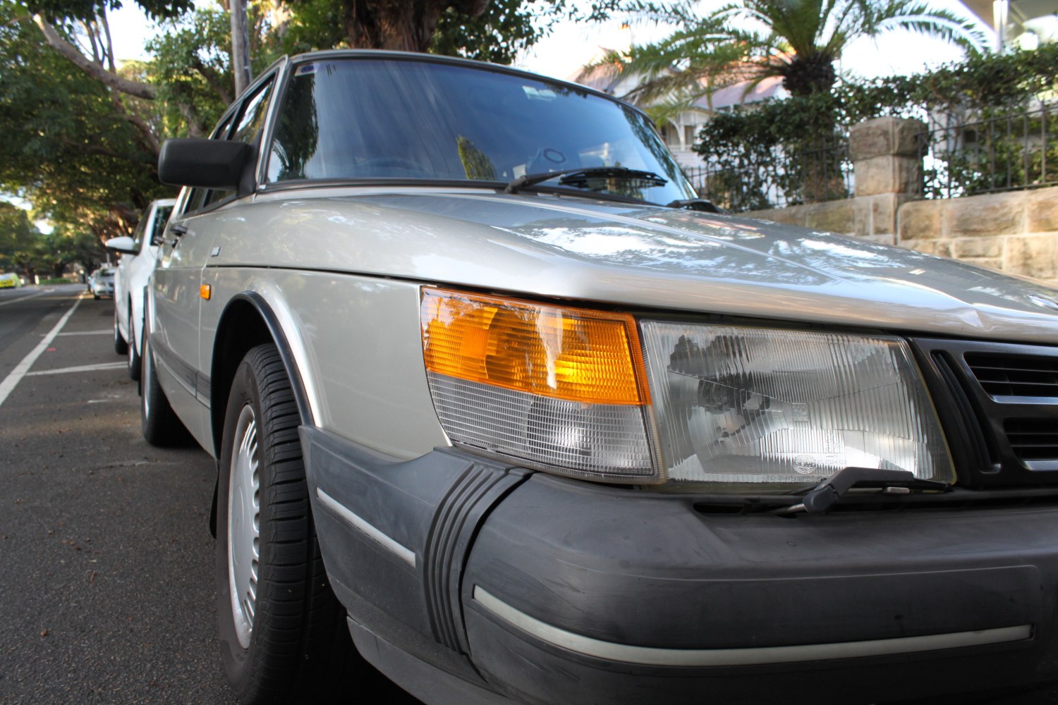 Close-up of front left headlight and bumper with turn signal