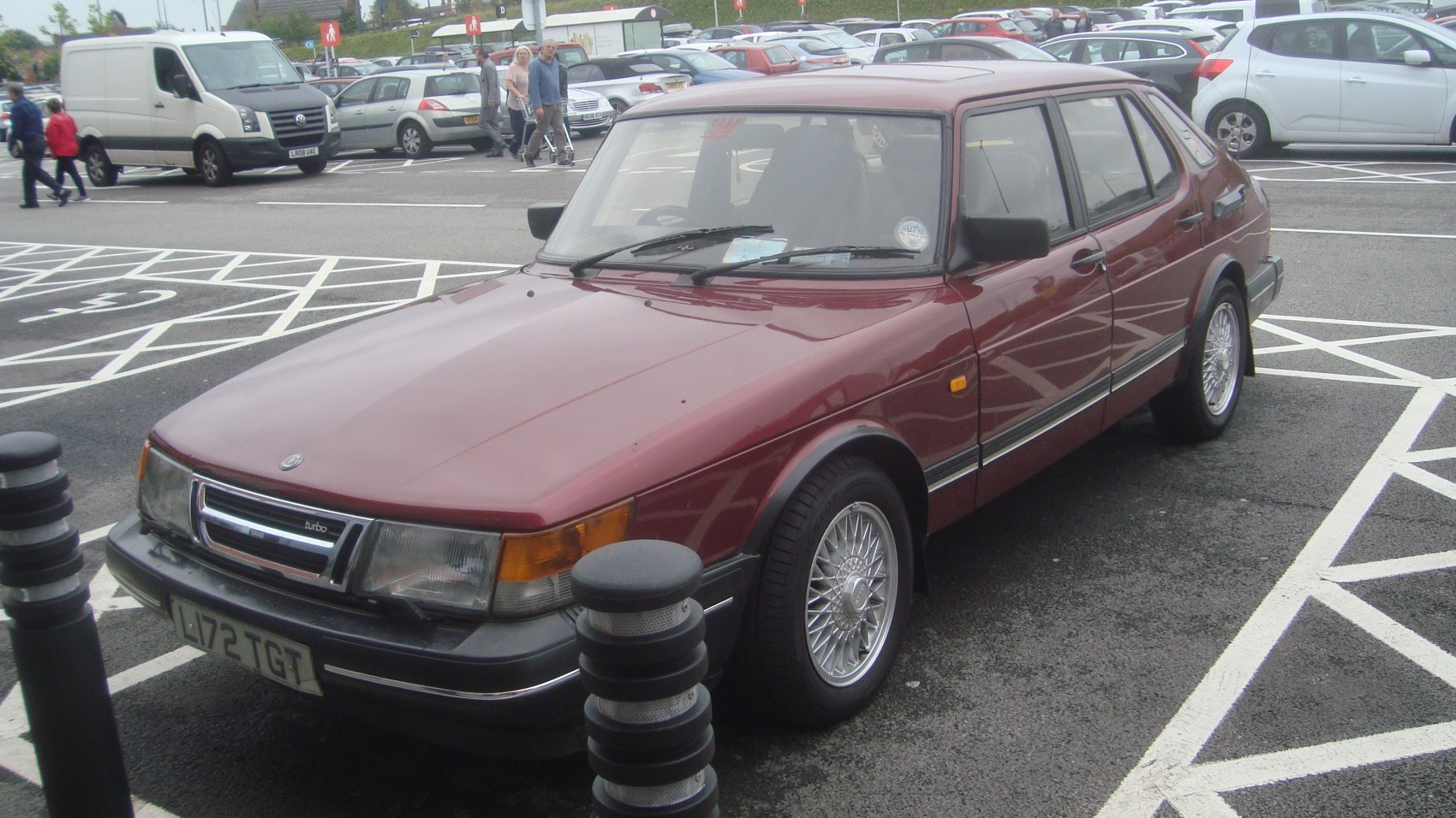 Boxy turbo sedan with wire-spoke alloy wheels