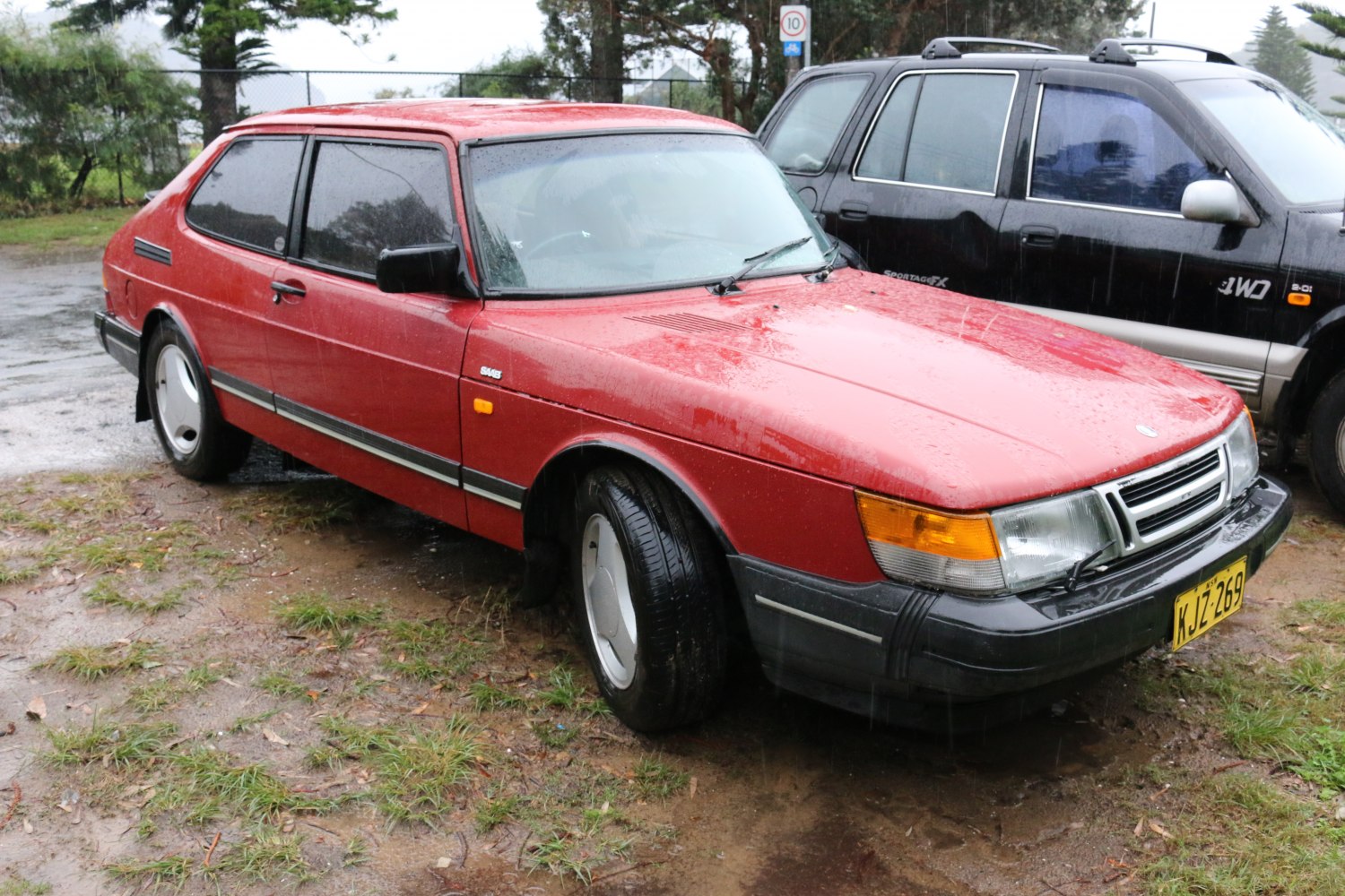 Red vintage coupe with facelift front design and unique hatchback rear profile