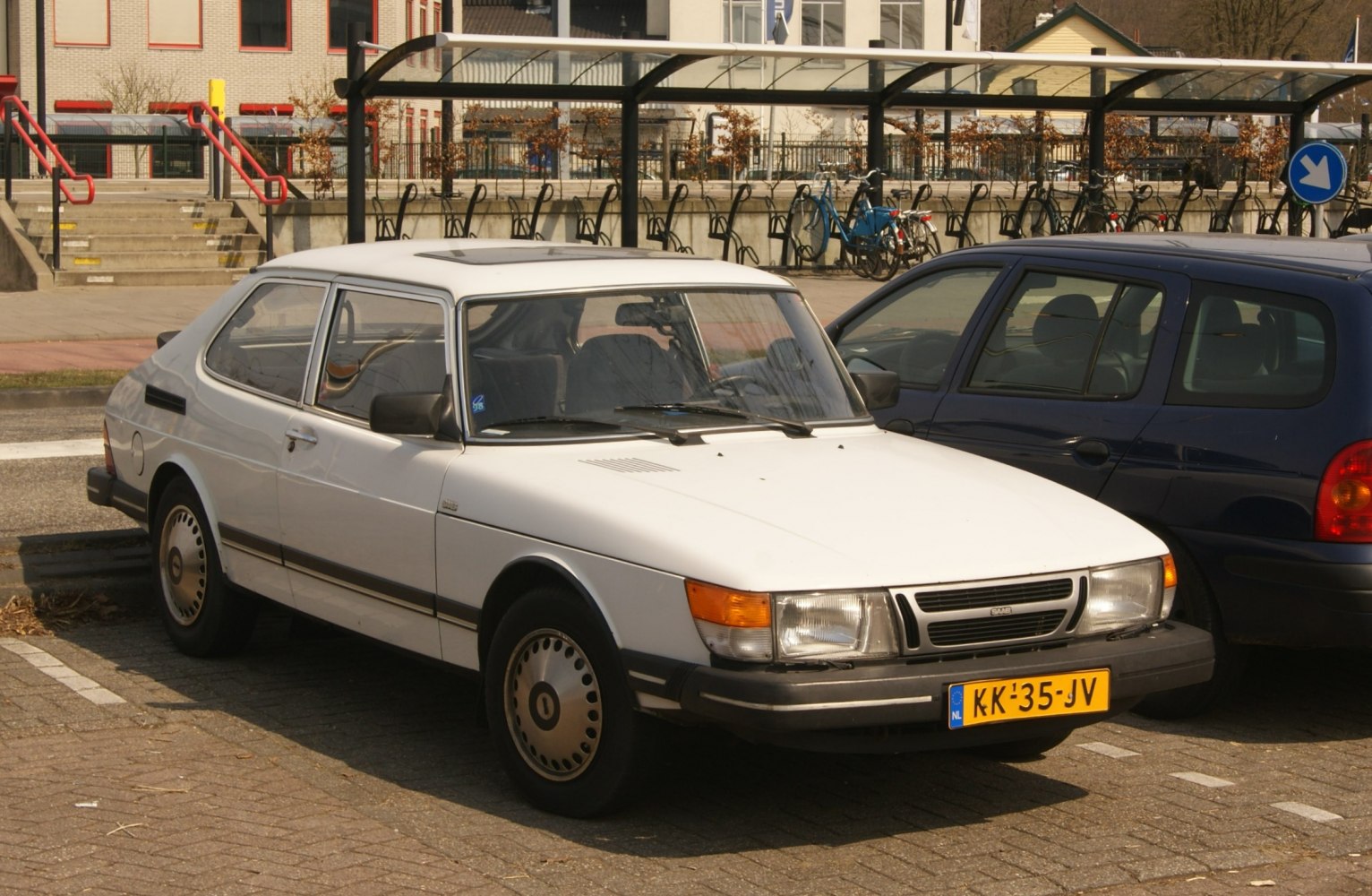 Front view of a classic compact coupe with angular design.