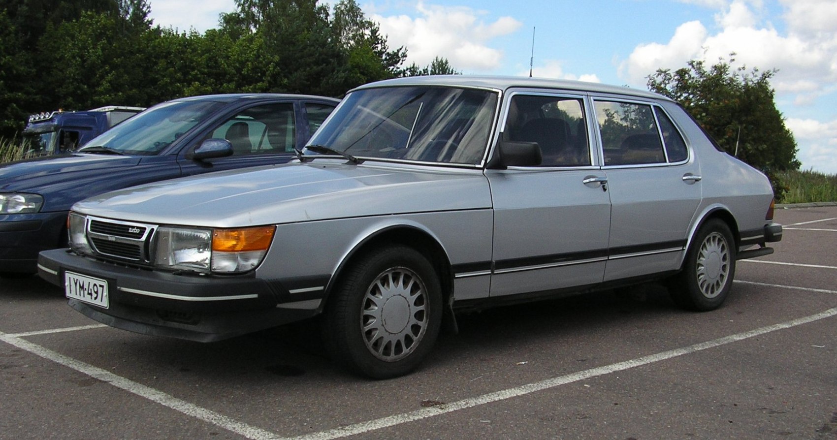 Classic boxy turbo sedan with distinctive wheels