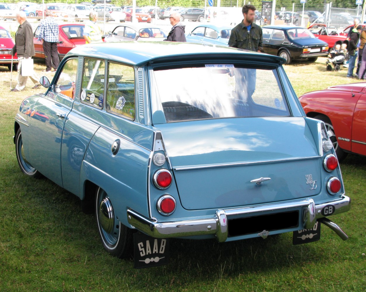 Rear view of vintage station wagon with rounded tail lights and chrome bumper