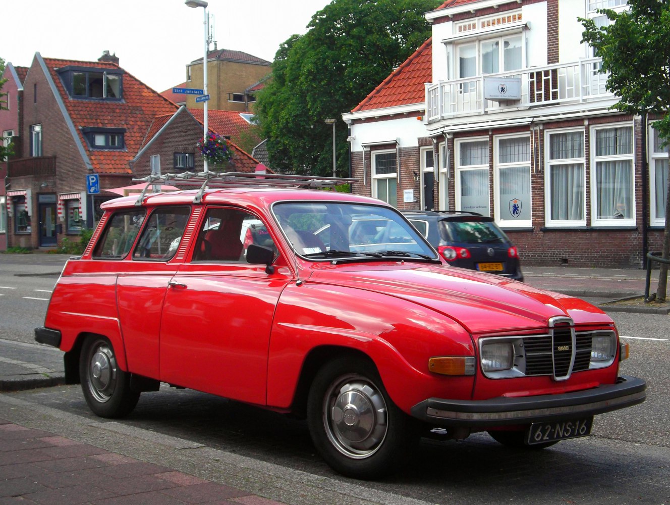 1960s retro station wagon with roof rack and classic front grille
