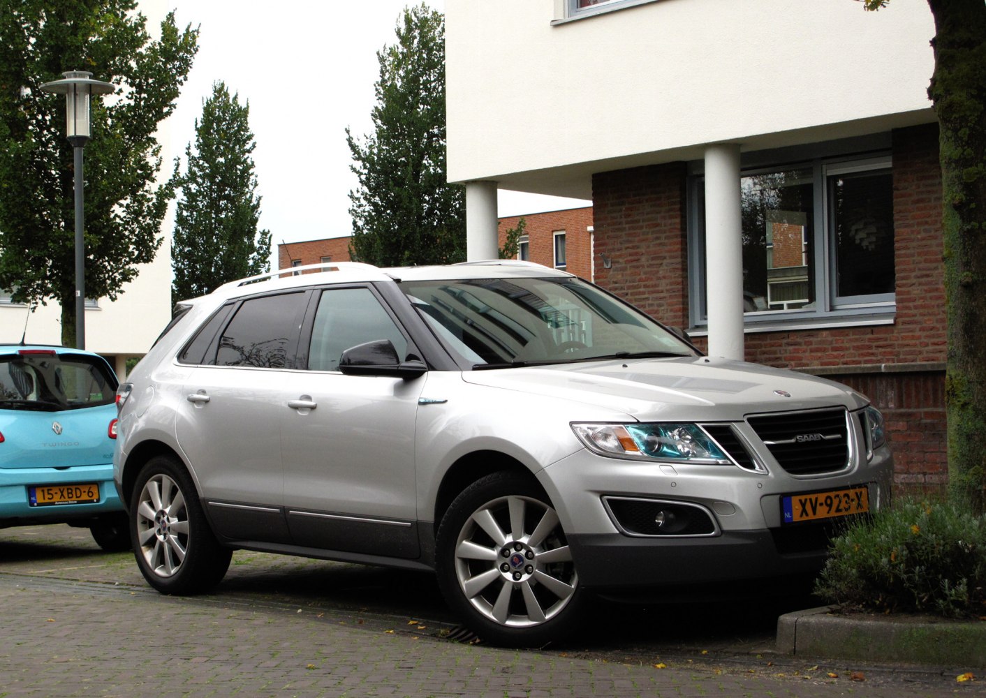 Silver crossover SUV with prominent grille and multi-spoke alloy wheels