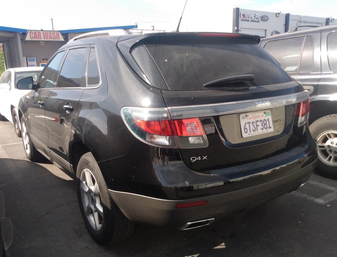 SUV rear with distinctive tail lights and dual exhaust