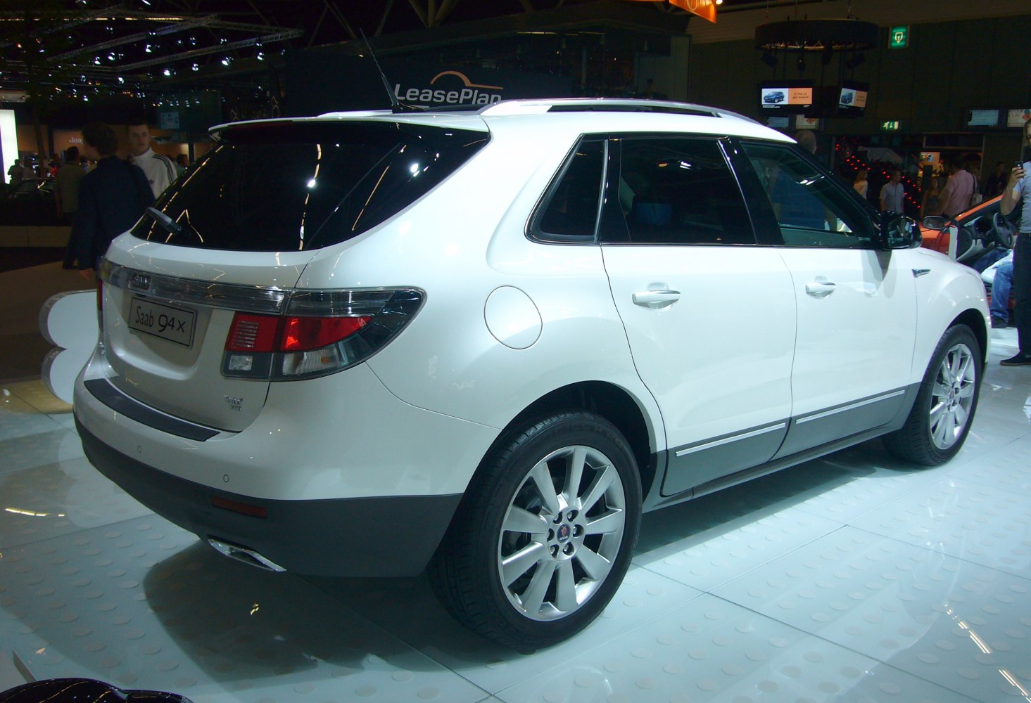 Rear side of SUV with alloy wheels and roof rails
