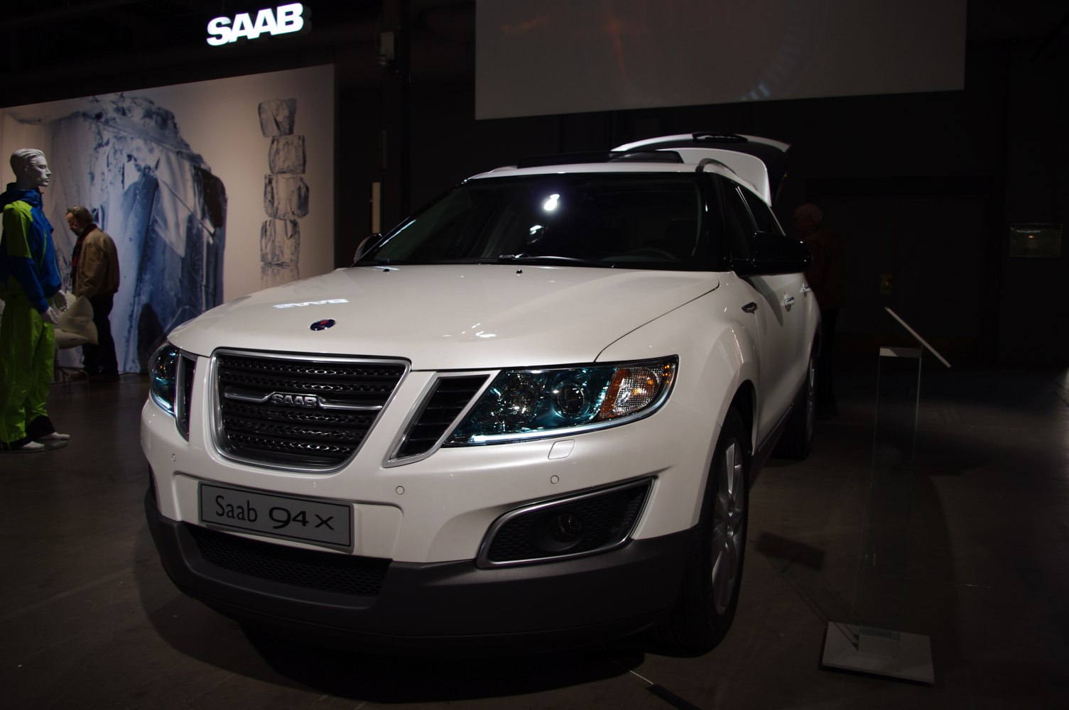 Front view of white SUV with grille and headlights