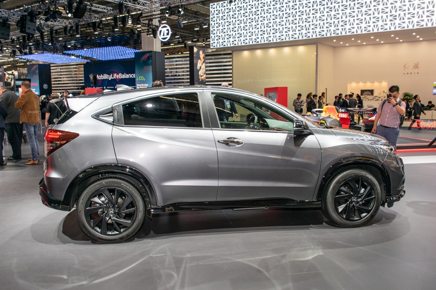 Side view showing sleek body lines and black alloy wheels