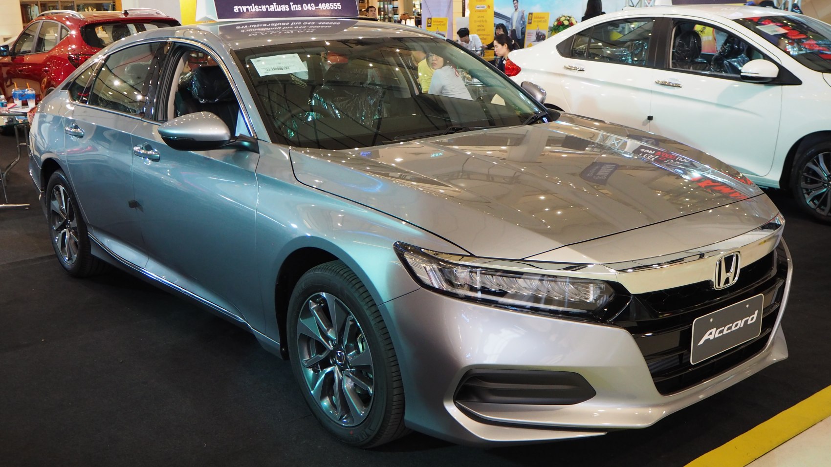 Silver sedan with modern LED headlights and polished alloy wheels