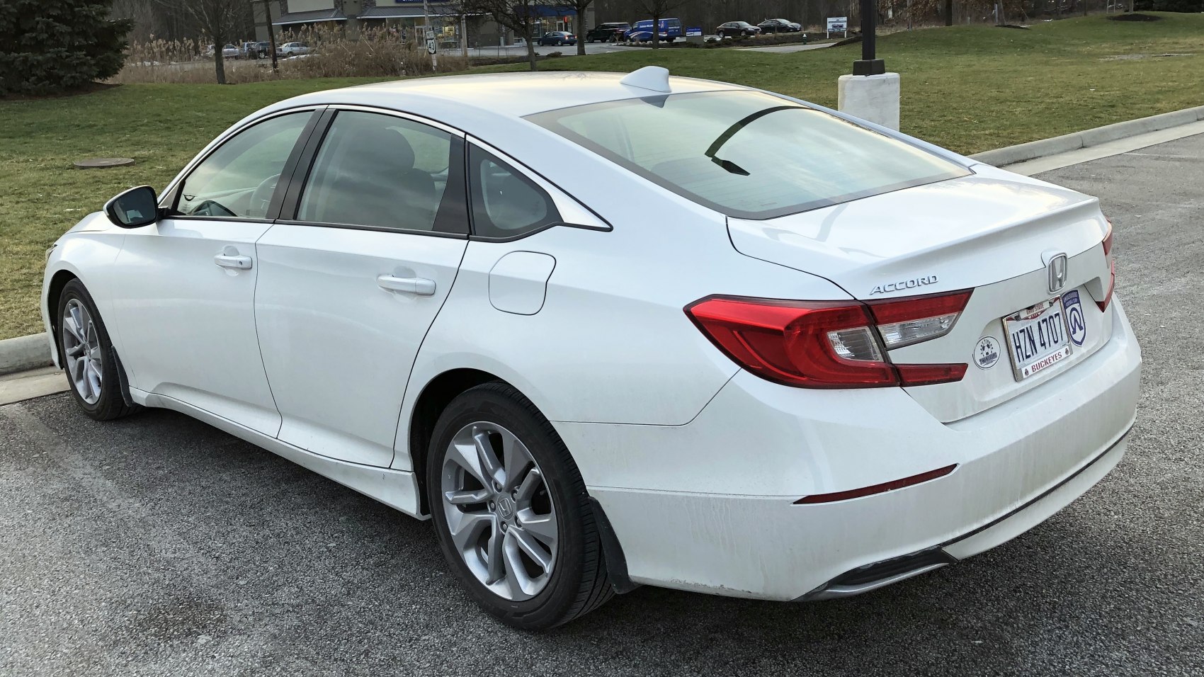 Rear side view with tail lights and alloy wheels