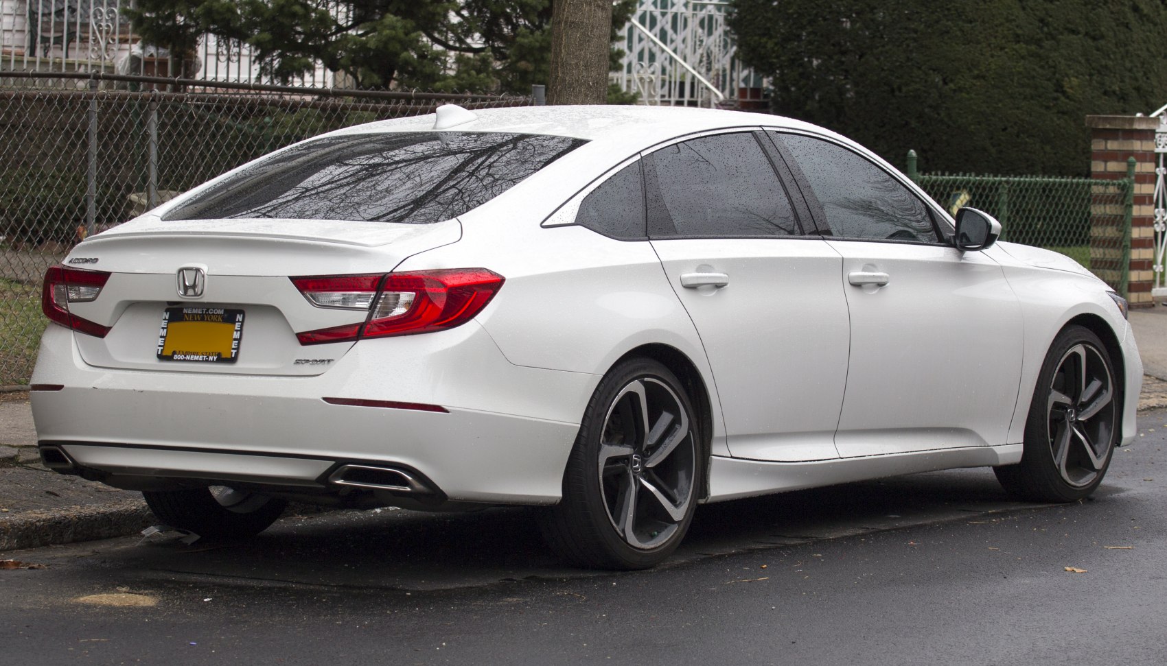 Rear side profile with sharp taillights and alloy wheels