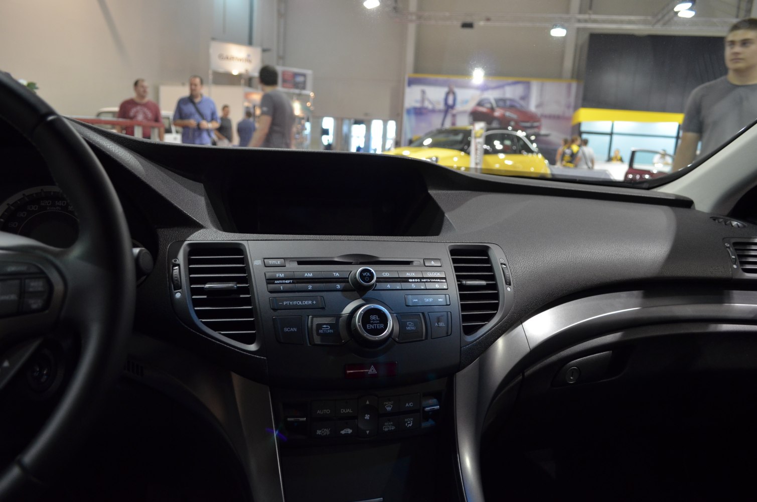 Car dashboard with central console, radio and climate control