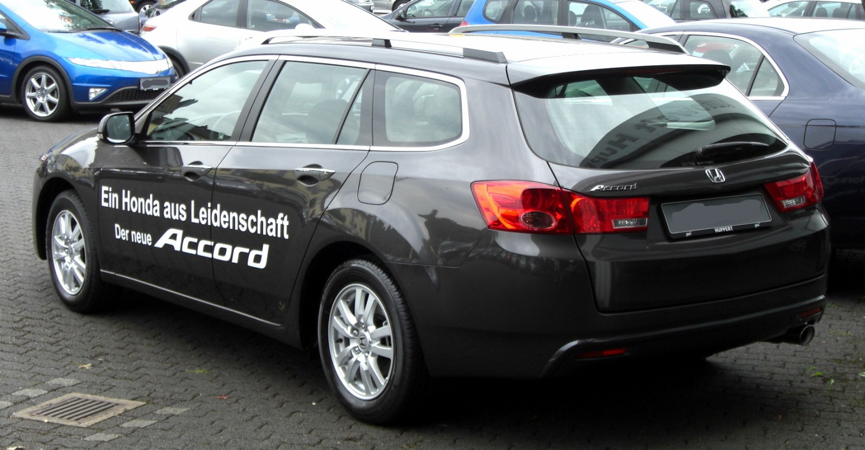 Rear side view of station wagon with alloy wheels