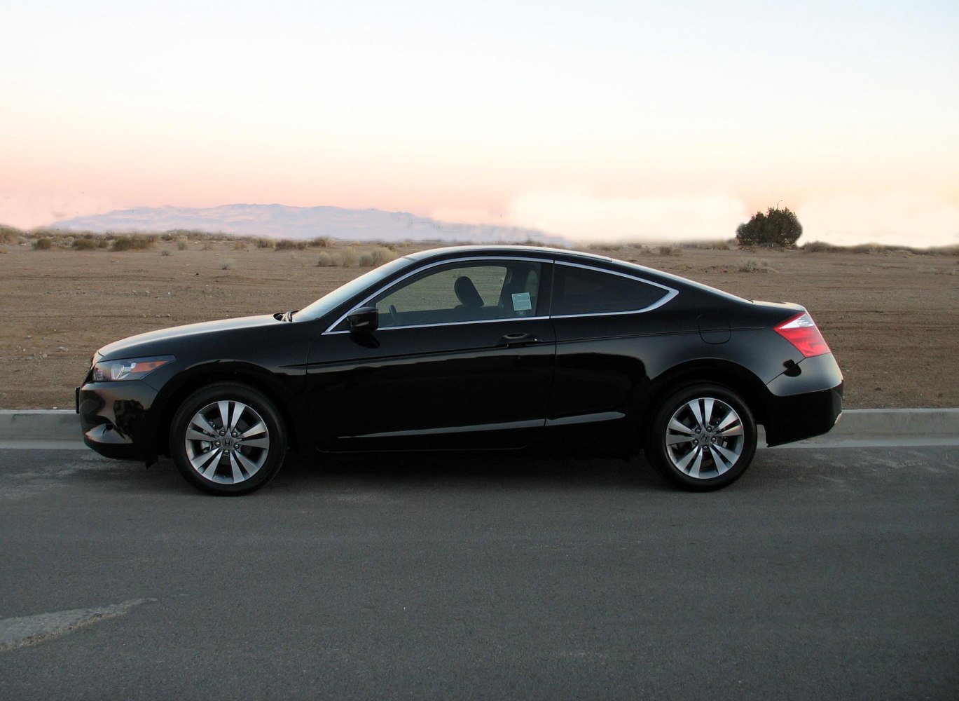 Sleek two-door coupe with aerodynamic shape and alloy wheels