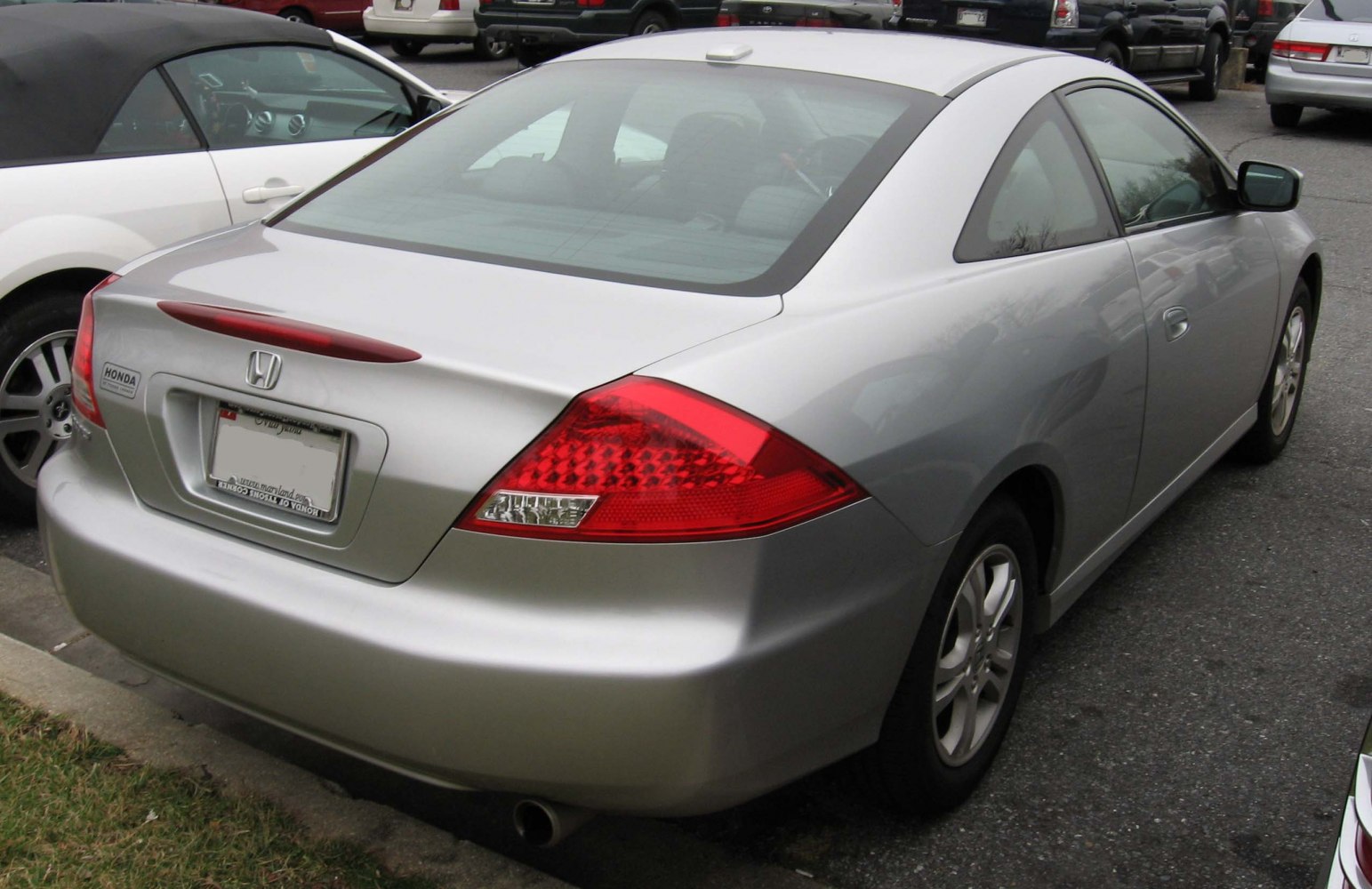 Rear view of coupe with sleek tail lights and smooth design