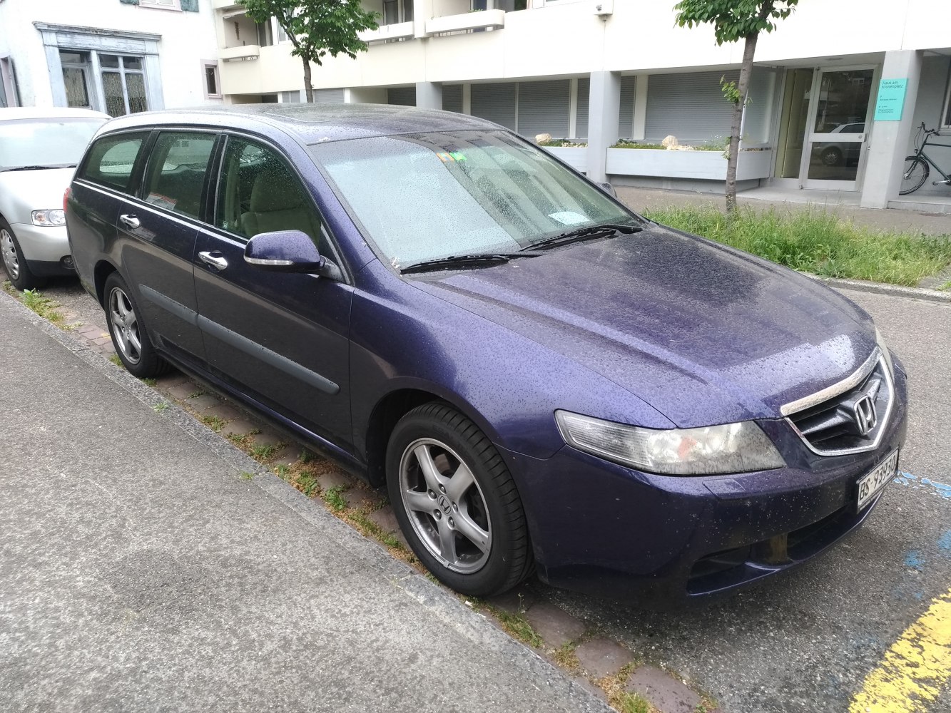 Front and side exterior view of mid-2000s station wagon