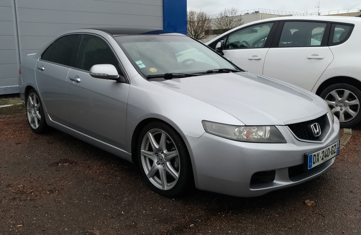 Silver sedan with alloy wheels and tinted windows