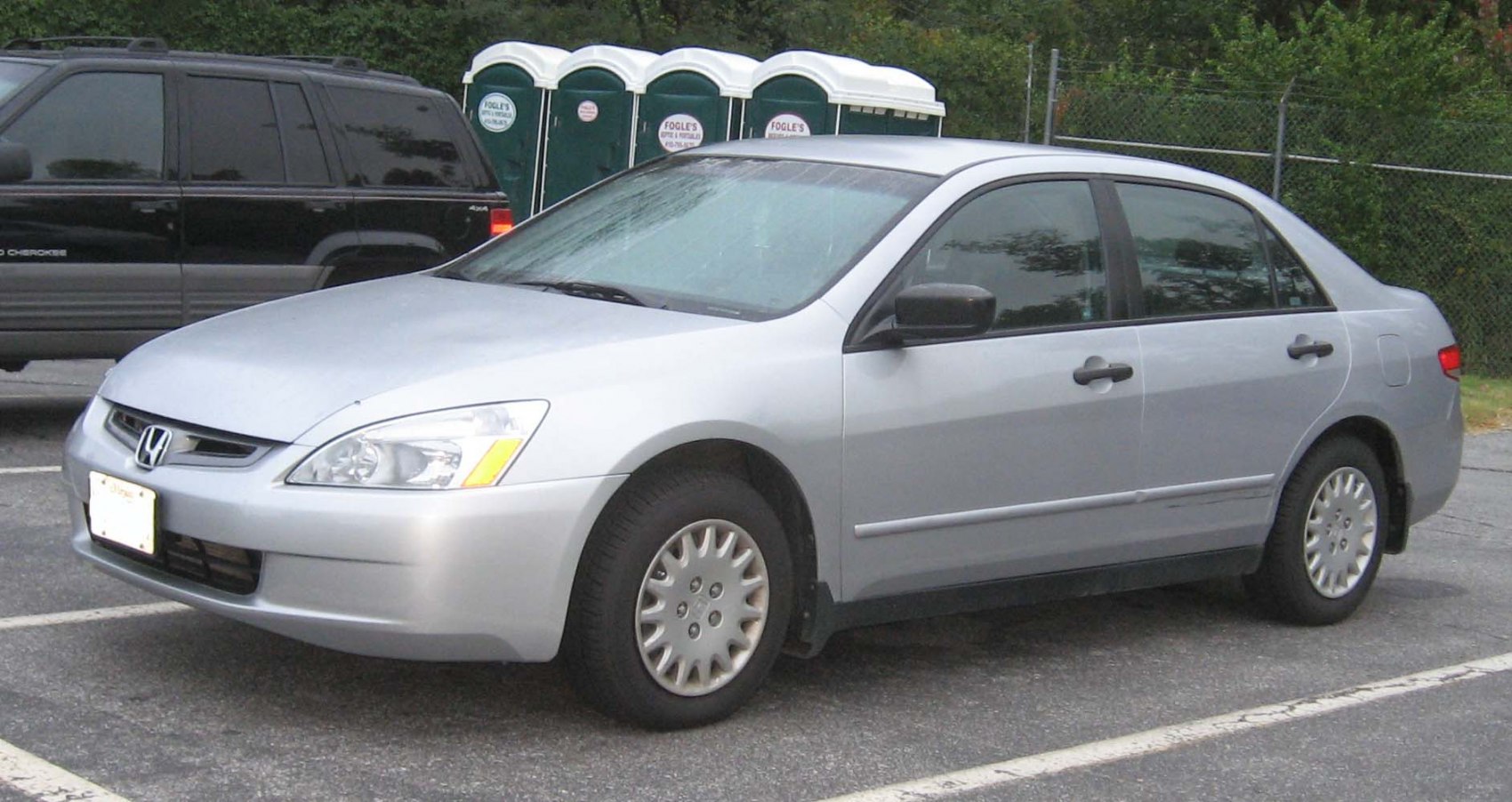 Mid-size sedan with classic alloy wheels and smooth aerodynamic body.