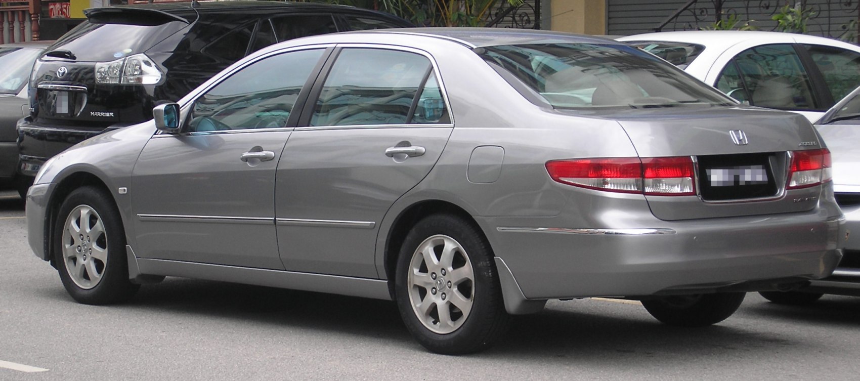 Rear side of a mid-2000s sedan with distinct taillight design