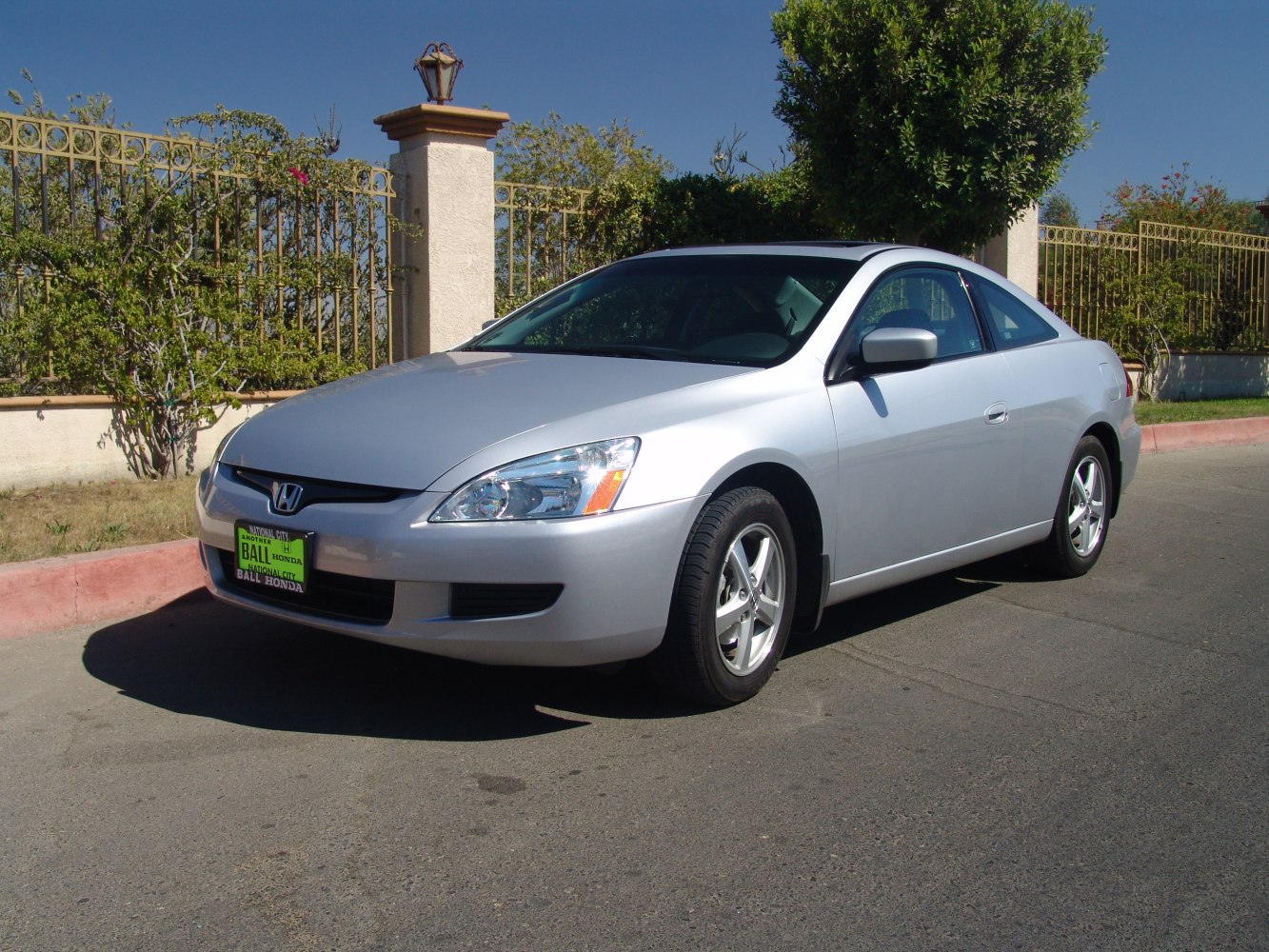 Silver 2-door coupe with alloy wheels and sunroof