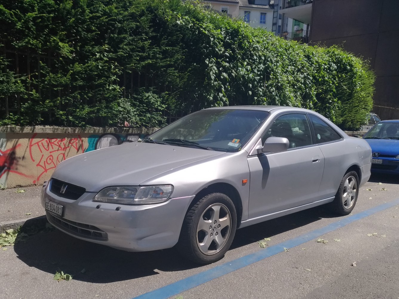 Silver two-door coupe with sporty design and alloy wheels