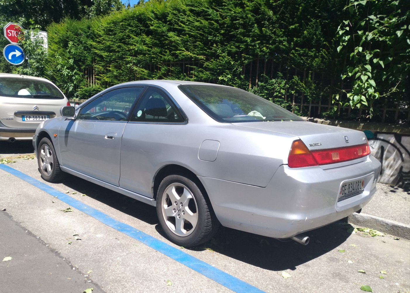 Silver two-door coupe with rear light bar and alloy wheels