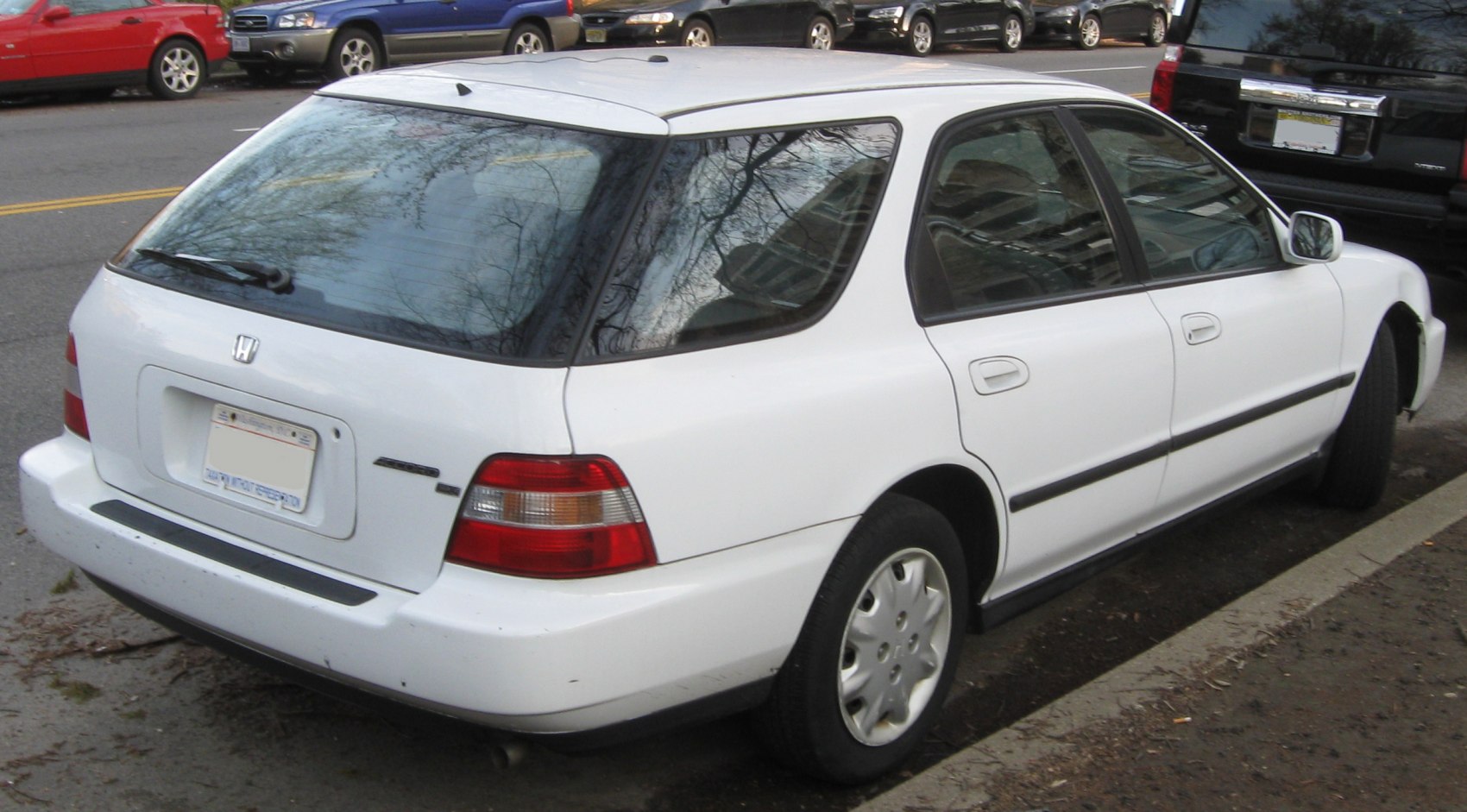 Rear three-quarter view of a boxy station wagon with distinctive tail lights.