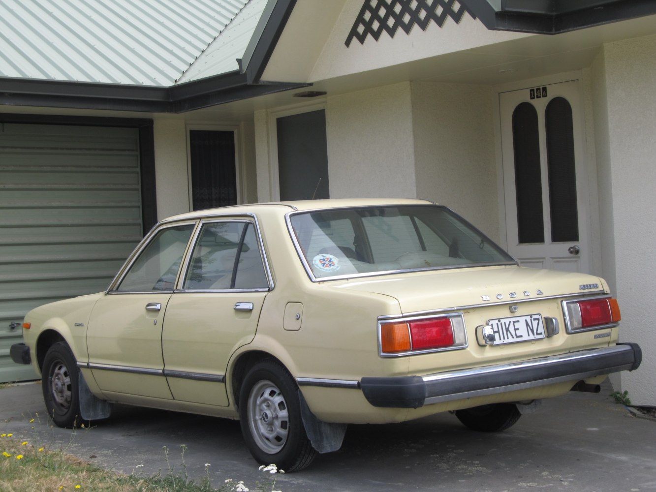 Rear view of vintage four-door sedan with rectangular tail lights