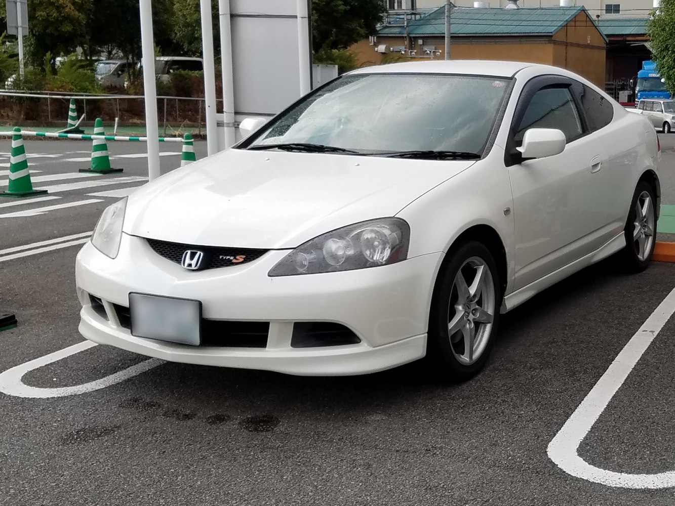 Front view of sporty coupe with distinctive headlights and grille