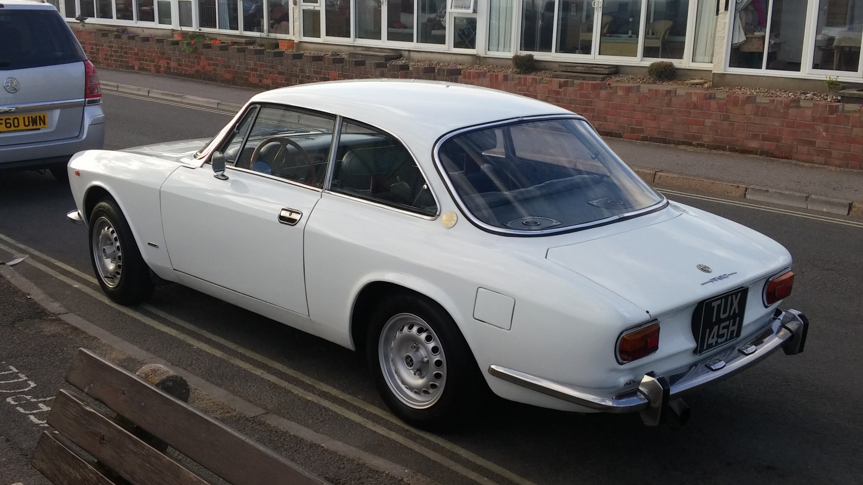 Vintage coupe with rounded rear window and chrome bumpers