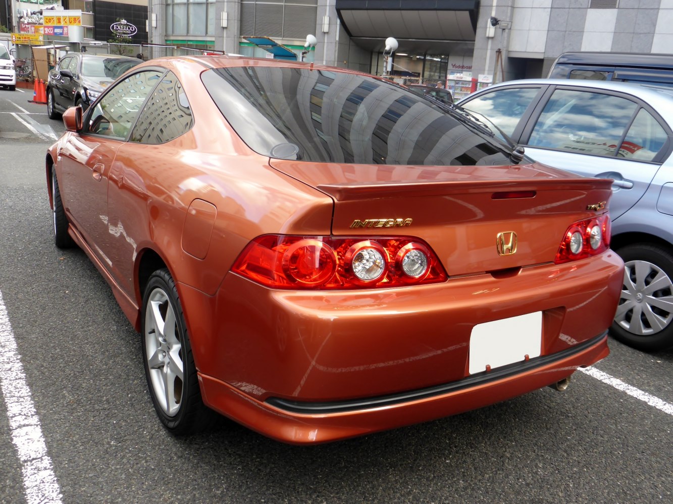 Rear view with distinctive tail lights and spoiler