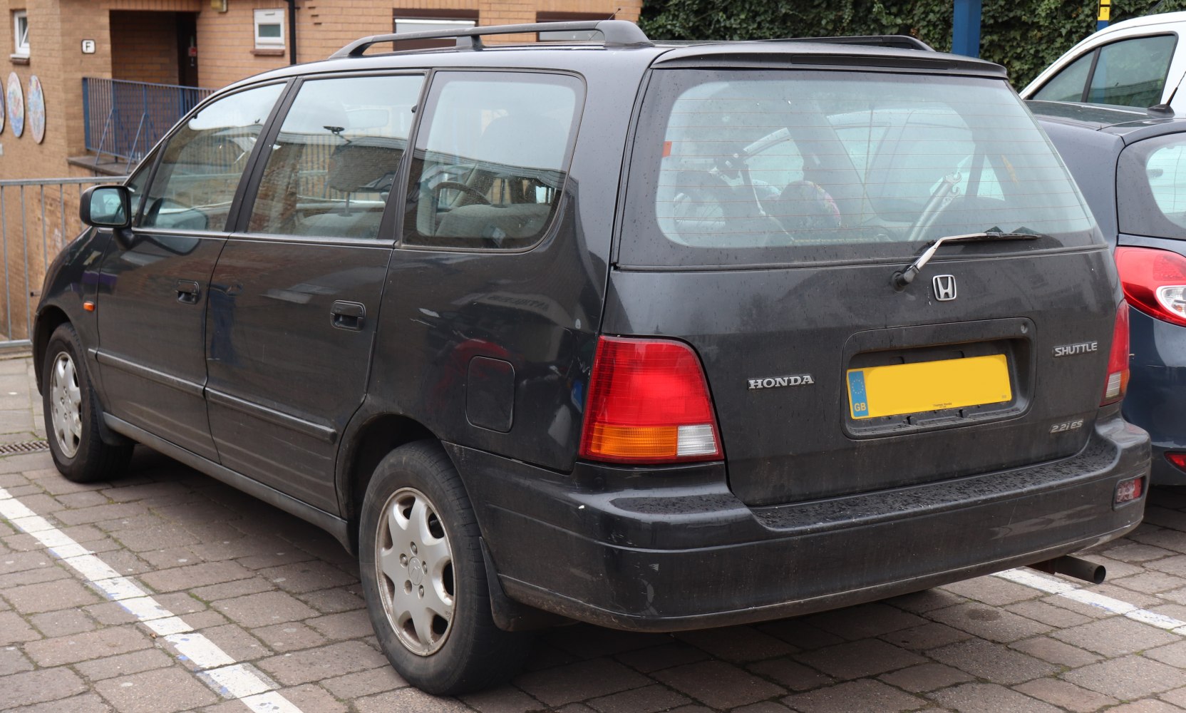 Rear and side view of compact wagon with distinctive tail lights and rear wiper