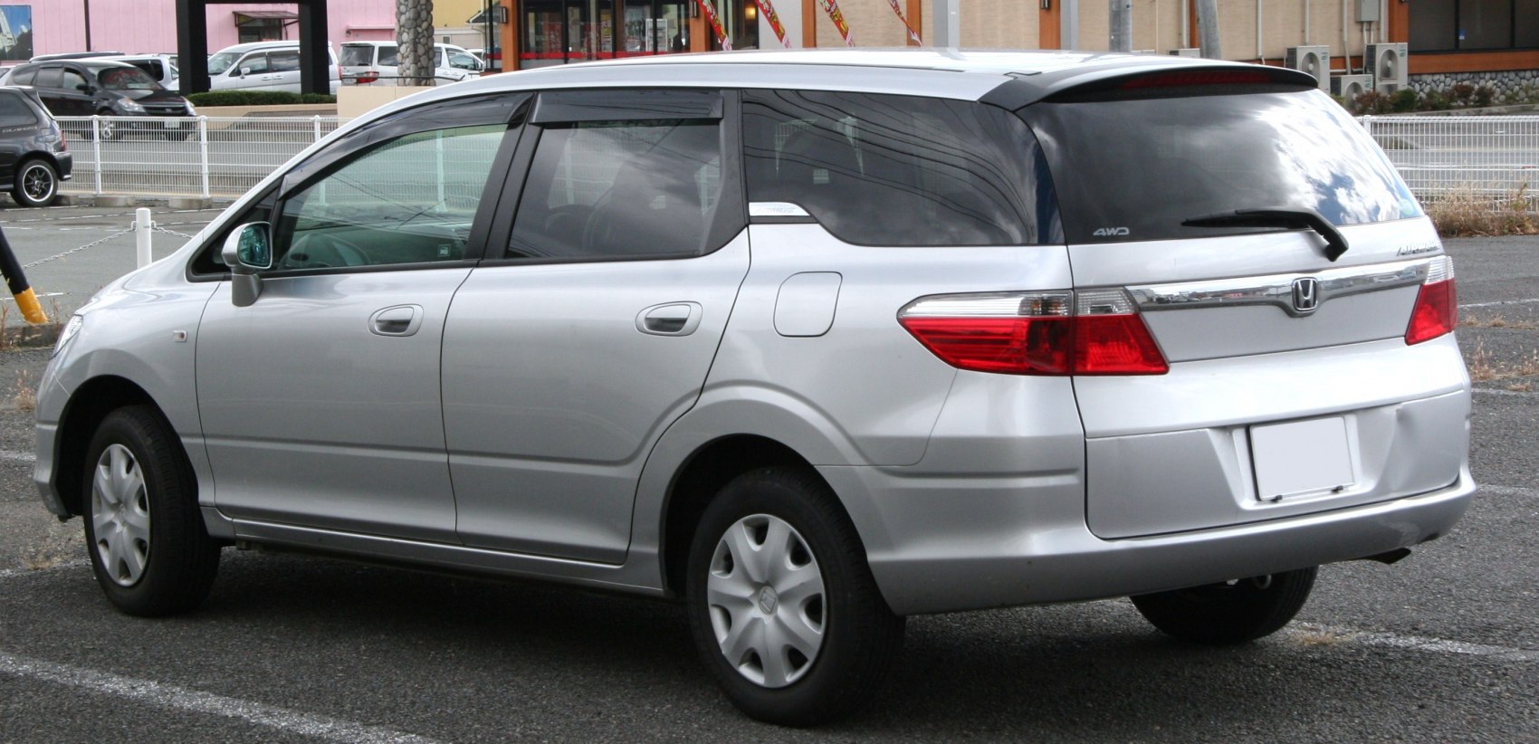 Silver compact wagon side rear view with 4WD and large rear window