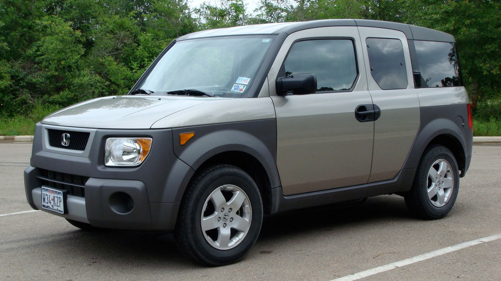 Boxy SUV with rugged cladding and rear-hinged rear doors