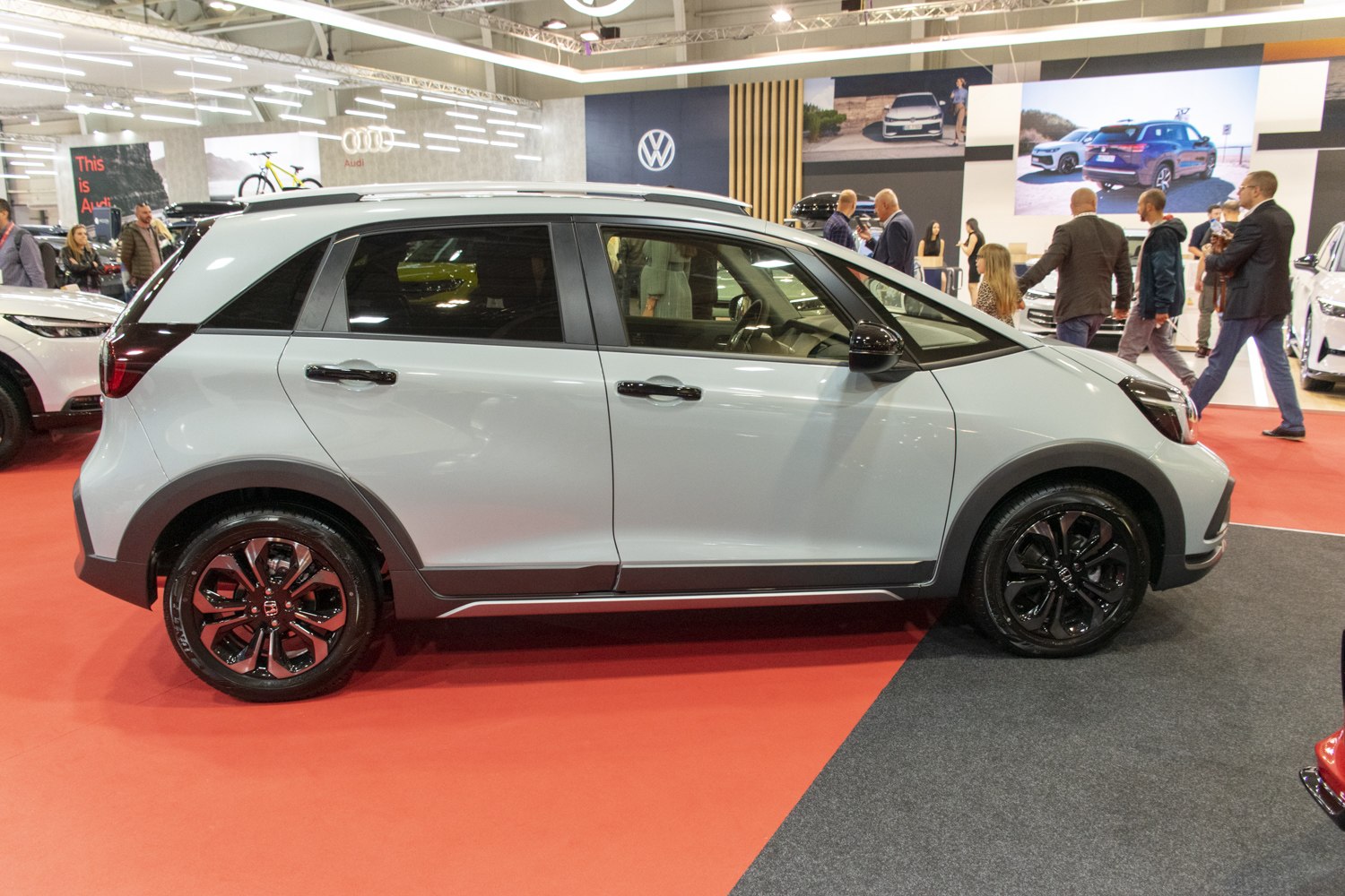 Side profile of compact hatchback SUV with tinted windows and black alloy wheels