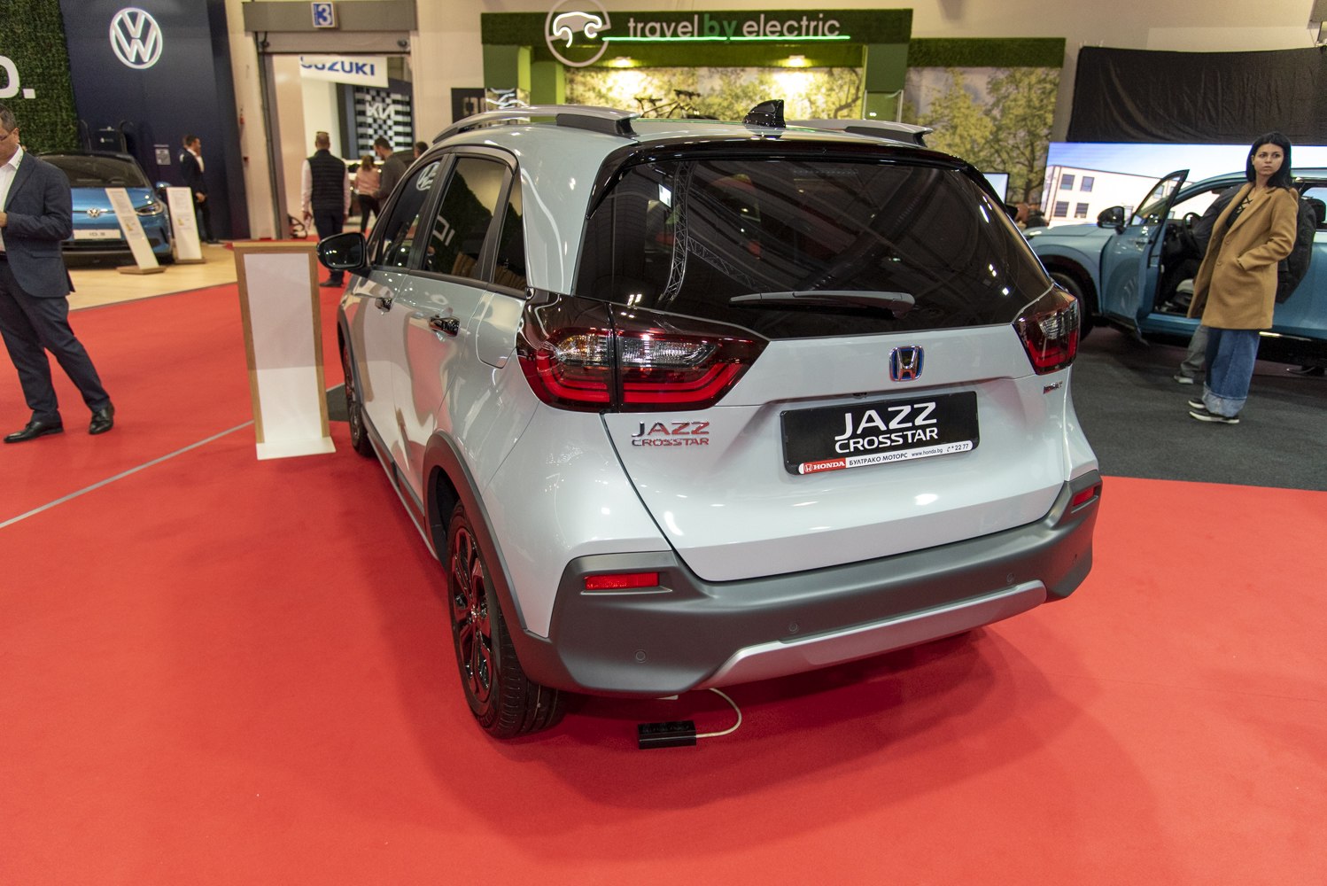 Rear view of a compact crossover with distinctive taillights and black roof spoiler