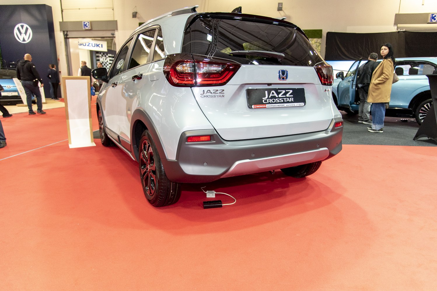 Rear view of compact hatchback with taillights and rear bumper.